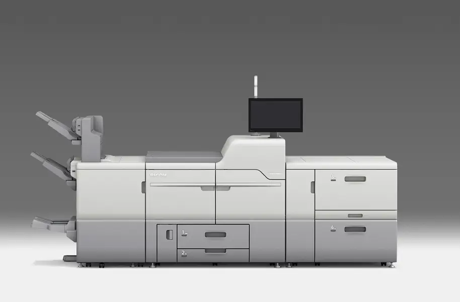 A large gray and white industrial printer with a control screen and multiple compartments on a gray background.